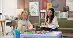 Building blocks, psychology and woman with child and clipboard for notes, development and progress. Therapy, writing and therapist with toys for girl for consulting, session and playing in office