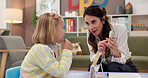 Consultation, psychologist and woman in office, girl and adhd with conversation, cards and help. Mature person, speech therapy and child with diagnosis, counseling evaluation and language learning