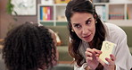Education, psychologist and woman with girl, cards and adhd with conversation, questions and help. Mature person, therapist and kid with counseling evaluation, child development and language learning