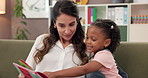 Reading, book and psychologist with child in office for speech development, learning or medical analysis. Storytelling, fantasy and pediatric therapist with girl kid for bibliotherapy at clinic.