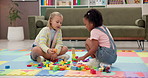 Building blocks, playing and children on floor in home for cognitive development or creativity. Learning, living room and girl kids with educational toys for fine motor skills or sensory in house.