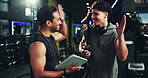 Tablet, fitness and men in gym, high five and support with challenge, exercise goals and personal trainer. People, instructor and bodybuilder with tech, hand gesture and app for progress or training