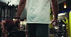 Man, hands and walking with bag at gym to start exercise, sports training and workout with water bottle. Athlete, back and arrival at health club with fitness equipment for performance and wellness