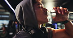 Drinking water, fitness and man in gym, thirsty and exercise with workout, resting and natural liquid. Person, bodybuilder or athlete in wellness center, intense training and challenge with hydration