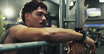 Tired man, gym and breathing with machine for rest, break or intense workout at health club. Active, male person or recovery with fatigue in fitness for weightlifting, training or physical exercise