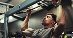 Fitness, training and man with pull up bar, gym and exercise for wellness and muscle with equipment. Health club, athlete and person with power for body, goal or bodybuilder with strength for workout