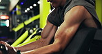 Fitness, bodybuilding and man with machine, arms and exercise for wellness and muscle with equipment. Health club, athlete and person with power for body, routine and bodybuilder with strength or gym