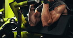 Fitness, bodybuilding and man with machine, gym and exercise for wellness and muscle with equipment. Health club, athlete and person with power for body, routine and bodybuilder with strength or arms