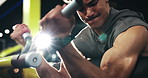 Power, bodybuilding and man with machine, arms and exercise for wellness and muscle with equipment. Health club, athlete and person with fitness for body, routine and bodybuilder with strength or gym