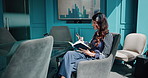 Finance, phone and reading with business woman in boardroom of office for stock market investment. Book, communication and trading with broker in professional workplace for wealth management