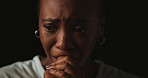 Stress, worry and tears of black woman on dark background with fear, nervous and confused expression. Scared, anxiety and isolated female person with phobia, emotions and crisis reaction in studio