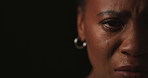 Face, half and black woman in studio, crying and mental health on dark background. African person, portrait and model with tears, depression or sad with anxiety, crisis and abuse with pain or stress
