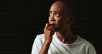 Confused, mental health and black woman in studio scared for trauma, emotional abuse and bipolar disorder. Psychology, danger and person with anxiety, depression and stress on dark background