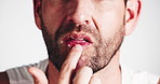 Hands, lips and skincare with salt in studio, exfoliate or routine for cleaning by white background. Person, mineral scrub and model with wellness for mouth, results or benefits with natural product