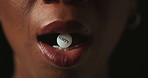 Mouth, pills and addiction in studio closeup with text for mind altering drugs by black background. Person, tablet and illegal medicine with opioid crisis, mood and happy with chemical compound