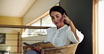 Home, reading book and woman on sofa, relax and novel with knowledge, hobby and leisure. Fantasy, apartment and mature person in lounge, literature and calm with wonder, story and comfortable