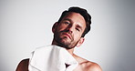 Skincare, man and dry face with towel for grooming, morning routine and facial hair removal. Hygiene, person and beard cleaning on mockup for healthy skin, self care and wellness on studio background