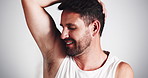 Hygiene, man and spray deodorant on armpit for odor control, fresh fragrance or sweat protection. Face, person or grooming with underarm product for self care and morning routine on studio background