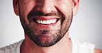 Man, mouth and teeth with smile for dental care, hygiene or fresh breath on a white studio background. Closeup, male person or happy model with beard for oral cleaning, gum wash or tooth whitening