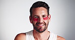 Eye mask, face and skincare with happy man in studio for antiaging, dermatology or moisturizing. Cosmetics, beauty and hydration with smile of person on gray background for aesthetic or wellness