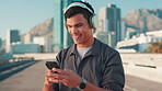 City, man and fitness with smartphone for music, streaming podcast and motivation for workout. Bridge, male person and runner with mobile app for headphones, audio track and change sound for exercise