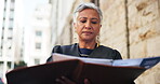 Reading, law and judge or woman in city for courtroom schedule, legal statement and justice constitution. Trial report, verdict claims and evidence review with mature magistrate for legislation