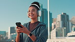 City, woman and fitness with smartphone for music, streaming podcast and motivation for workout. Bridge, female person and laugh with mobile for headphones, audio track and change sound for exercise
