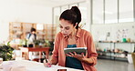 Woman, writing and tablet in small business for planning, inventory management or clay order with checklist. Mature entrepreneur, tech or paper in pottery studio for account invoice or ceramic supply
