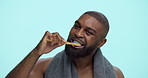 Face, bamboo toothbrush or black man in studio on blue background for dental smile, wellness or beauty. Portrait, eco friendly or person with routine for brushing teeth, cleaning mouth or oral health