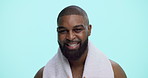 Happy man, face and hygiene with towel in studio for personal cleanliness on a blue background. Portrait, male person or model with smile or beard for shower, fresh odor or body wash on mockup space