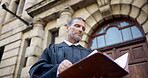 Thinking, documents and judge or man in city for trial report, policy legislation and justice guideline. Lawyer idea, attorney paperwork and vision with mature person at courtroom low angle for file