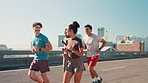 City, bridge and people with running for fitness, wellness challenge and training for marathon with friends. Outdoor, women and men with endurance for exercise, cardio and support for workout on road