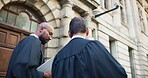 Judge, men and lawyer discussion in city for legal case collaboration, criminal justice and bail decision. Back, people and walking by courthouse for trial presiding, litigation verdict and planning