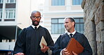 Judge, people and lawyer discussion in city for legal case collaboration, trial preparation or bail decision. Low angle, colleagues or walking by courthouse with litigation verdict planning or advice