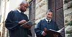 Collaboration, lawyer and people with tablet, outdoor and research for case on website, low angle and online. Browsing, advocate and group with tech for lawsuit, documents and legal info in city