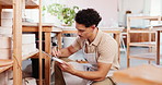 Pottery studio, small business and man with clipboard for inventory, management and planning in store. Startup owner, writing and ceramics checklist, stock or invoice by shelf for craft product