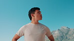 Thinking, athlete and man with blue sky for fitness travel, planning and ideas for workout break. Space, male person and thoughts for runner reflection, sports recovery and nature scenery of wellness