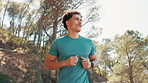 Man, fitness or running with trees in nature for workout, cardio training or outdoor exercise. Active, male person or runner jogging with health in forest for sprint or marathon challenge on mountain