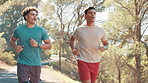 Men, running and partner at park, fitness and path in nature, training and workout for wellness in summer. People, personal trainer and exercise for marathon, outdoor and challenge in Colombia