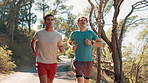 Men, running and partner at park, training and path in nature, fitness and workout for wellness in summer. People, personal trainer and exercise for marathon, outdoor and cardio challenge in Colombia