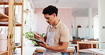 Man, technology and potter in workshop for small business, inventory management and stock checklist. Entrepreneur, phone and series in startup for account payment, social media marketing and smile