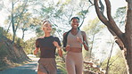 Women, running and partner at park, training and path in nature, fitness and workout for wellness in summer. People, friends and girl with exercise for marathon, outdoor and challenge with cardio