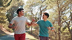 Men, running and fist bump at park, training or path in nature, fitness or support for workout in summer. People, personal trainer and exercise for marathon, outdoor or cardio challenge in Costa Rica