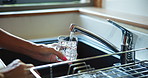 Hands, tap water or woman with glass, thirsty or kitchen with wellness, hydration or sink. Closeup, home or person with open faucet, filtration system or fresh beverage with healthy skin detox or cup