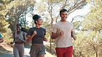 Running, fitness and friends outdoor in nature for workout, wellness and training for marathon. Talking, man and woman with happy runner group on mountain trail for jog, exercise or cardio sport