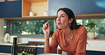 Mature, happy woman and eating salad in house kitchen for nutrition and leafy greens in healthy diet. Vegetables, bowl and hungry person enjoying taste of food and organic vegan meal for wellness