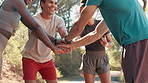 Men, women and stack hands for training, outdoor and motivation with success, smile and fitness in nature. People, group and huddle with celebration, cheers and excited for workout at park in summer