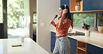 Dancing, headphones and woman with music in kitchen for singing with spoon for fun or entertainment. Energy, karaoke and female person moving with audio tech for playlist, album or radio in home.