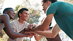 Men, women and stack hands for exercise, outdoor and motivation with success, smile and training in nature. People, group and huddle with celebration, cheers and excited for fitness at park in summer