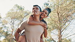 Happy, couple and piggyback for fitness in nature for exercise, fun training and playful break. Smile, people and hug with relationship, romance and bonding together for sightseeing of travel workout